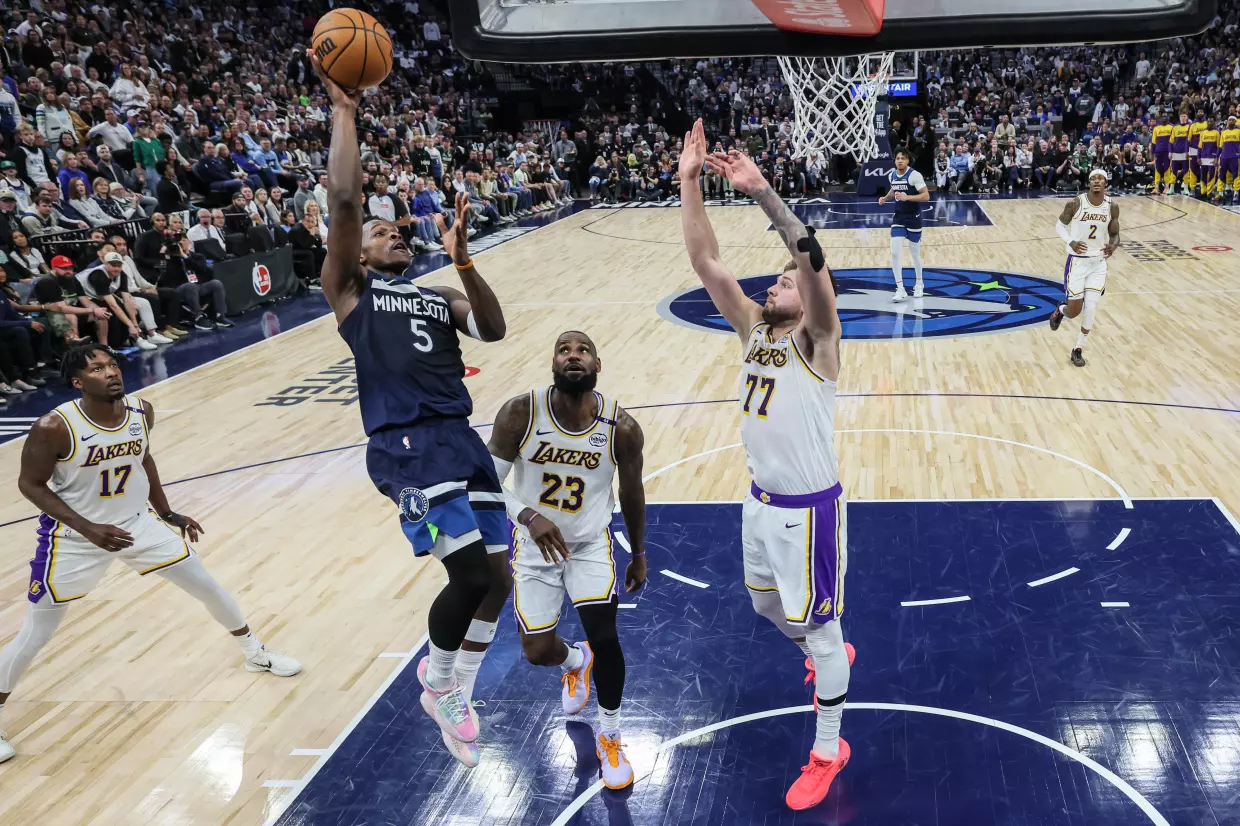 Anthony Edwards of the Minnesota Timberwolves shoots over LeBron James and Luka Doncic in Sunday's fourth game.