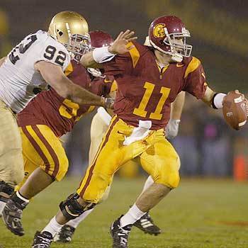 USCs Matt Leinart gets away from Notre Dames Kyle Budinscak in the first half during the game.