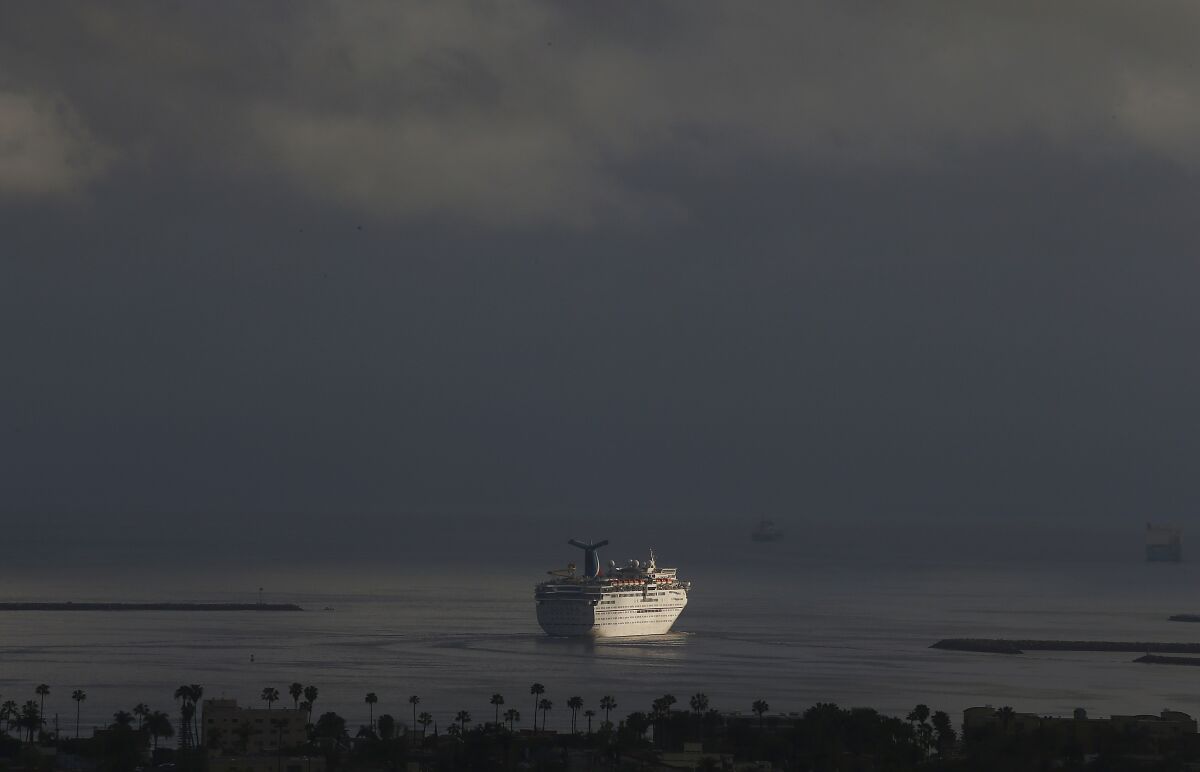 A Carnival cruise ship leaves the Port of Long Beach under stormy skies on March 13. 