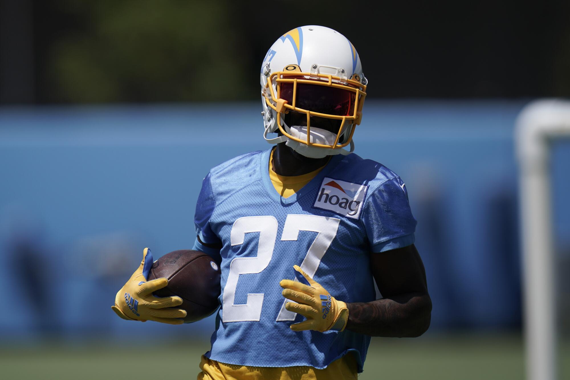 Chargers cornerback J.C. Jackson carries the ball at the NFL football team's practice facility.