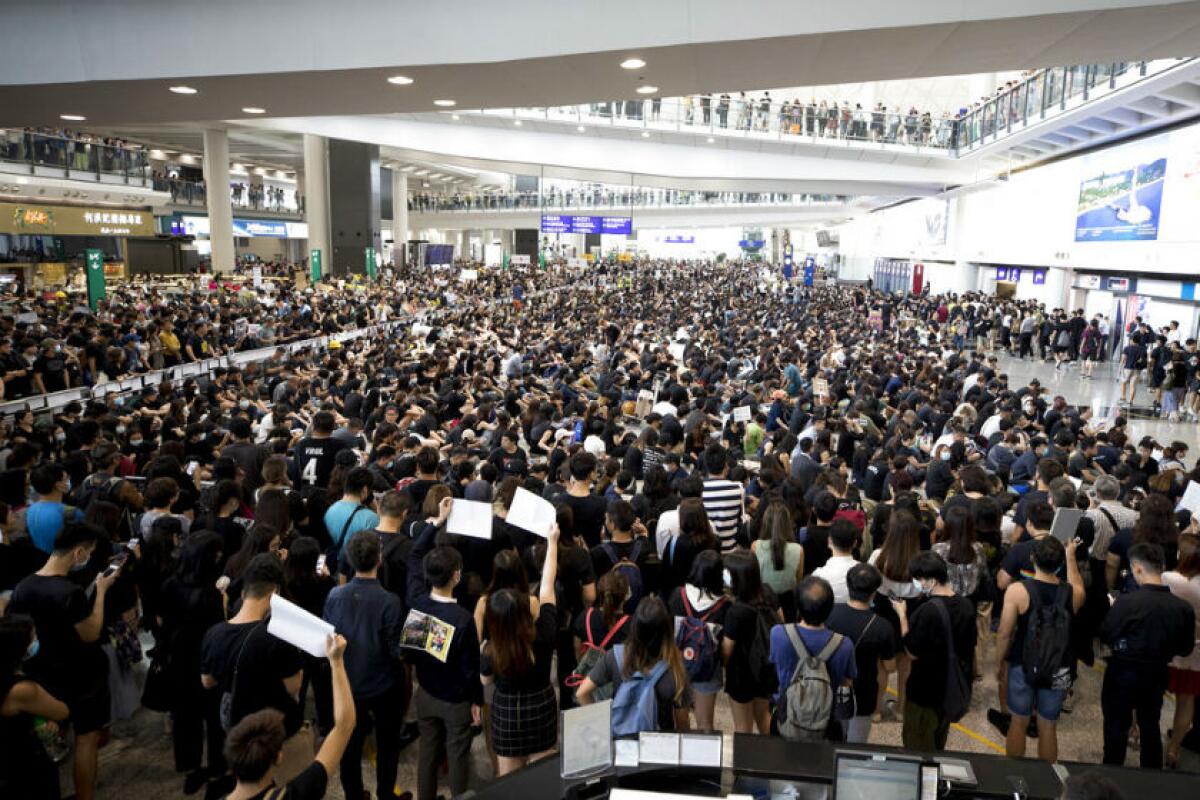 Protesters demonstrate at the airport in Hong Kong on Monday.