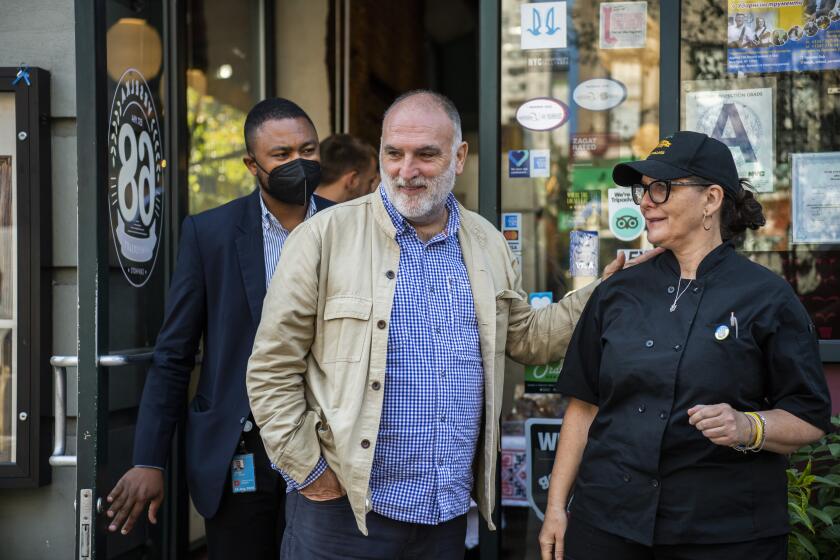  Jose Andres, founder of World Central Kitchen, exits Veselka with chef Chef Olesia Lew, Sept. 16, 2022, in New York. 