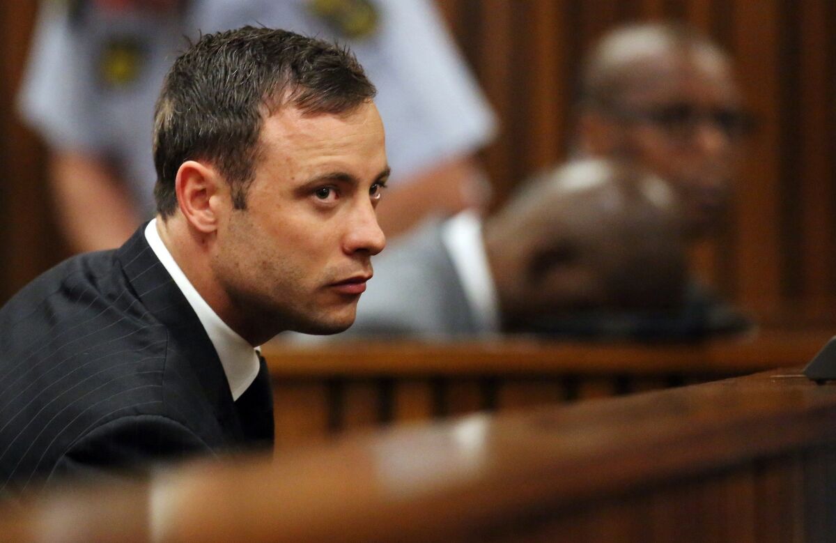 South African Olympic and Paralympic athlete Oscar Pistorius listens to the verdict during his murder trial in September.