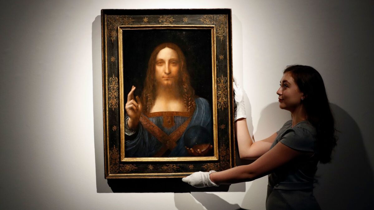 Leonardo da Vinci's "Salvator Mundi" on display at Christie's auction room in London before the November auction. The rare painting of Christ sold for a record $450 million.
