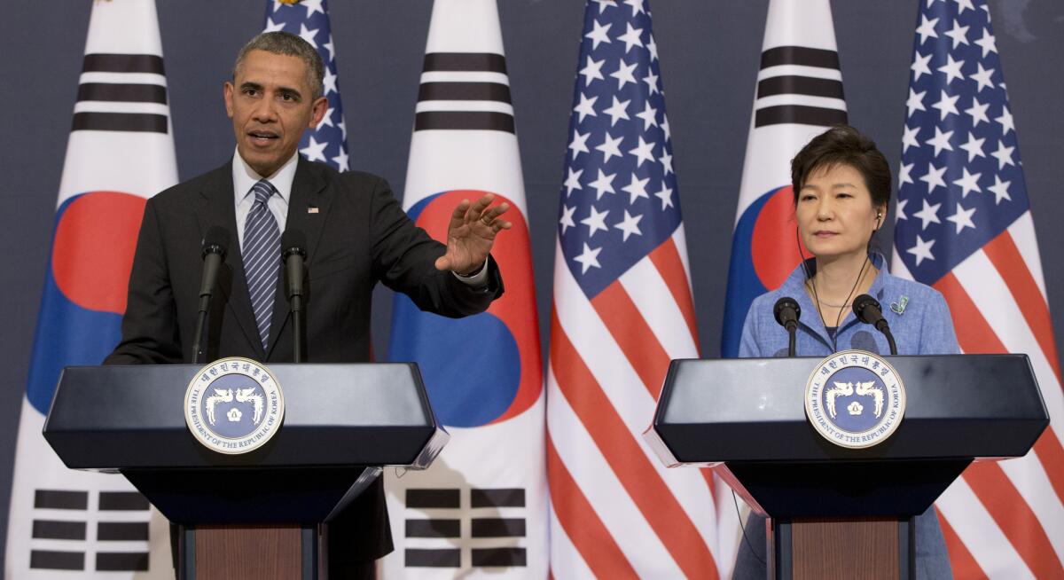 President Obama speaks as South Korean President Park Geun-hye looks on during a joint news conference in Seoul.
