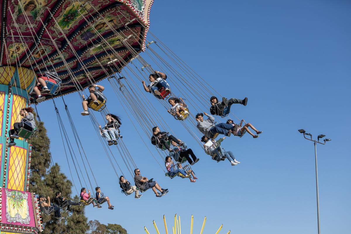The Garden Grove Strawberry Festival will feature carnival rides like the Kite Flyer, Tilt-a-Whirl and Scrambler.