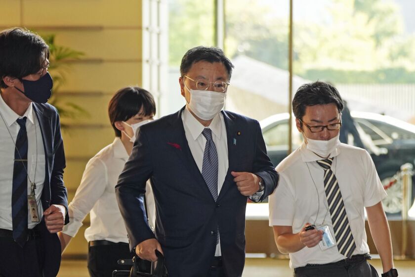 Japan's Chief Cabinet Secretary Hirokazu Matsuno arrives at the prime minister's office in Tokyo.