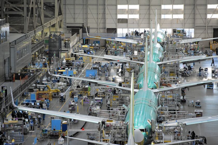 During the third quarter, Boeing delivered 186 commercial jets, up from 170 during the same period last year. Above, the 737 final assembly line in Renton, Wash.
