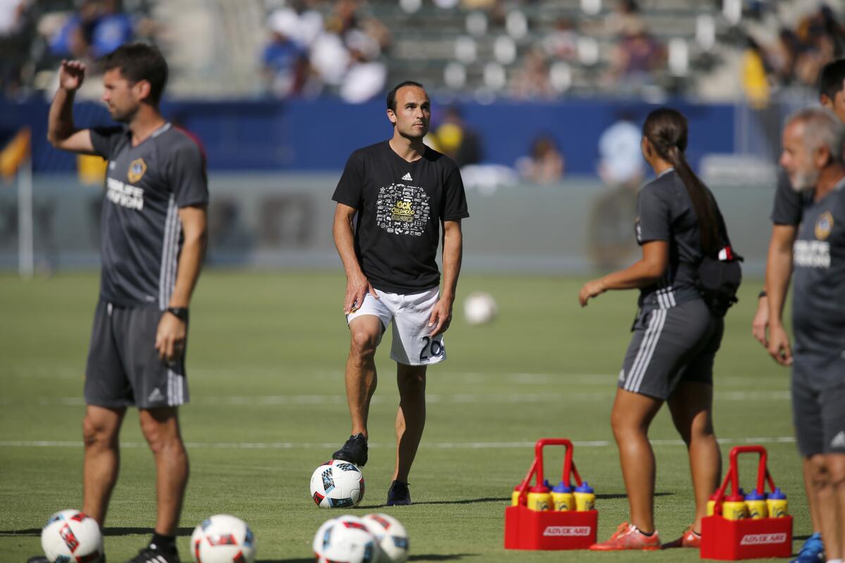 Galaxy forward Landon Donovan looks around the stadium before his first game back from retirement against the Orlando City SC at Stub Hub Center on Sunday.