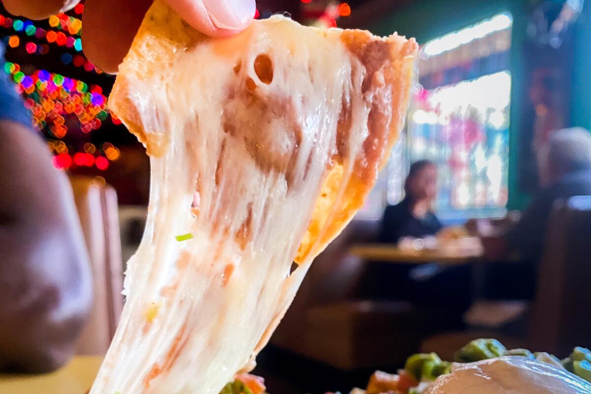 The good nacho cheese pull at El Coyote, one of L.A.'s classic Mexican restaurants.