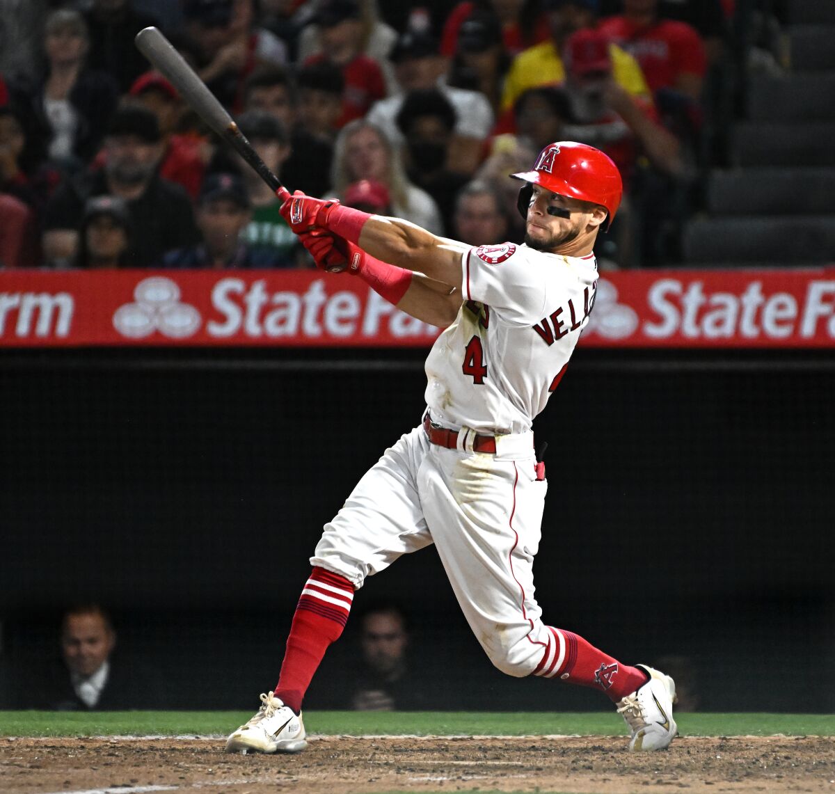 Angels' Andrew Velazquez hits a three-run home run against the Boston Red Sox.