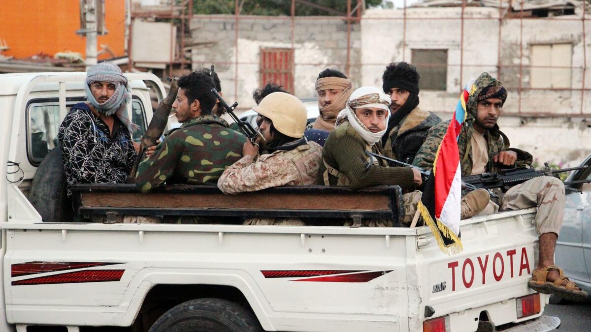 Armed supporters of the separatist Southern Movement patrol a street after clashes in the southern port city of Aden, Yemen, on Jan. 28.