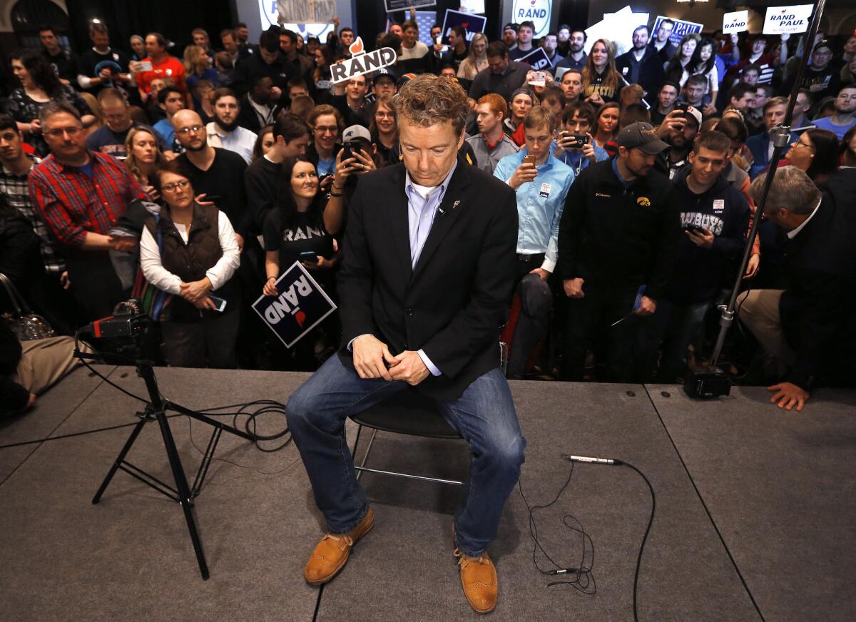Sen. Rand Paul (R-Ky.) waits for an interview during a campaign event at the University of Iowa on Jan. 31. On Wednesday, Paul announced he was suspending his campaign for president and would seek re-election to the Senate.