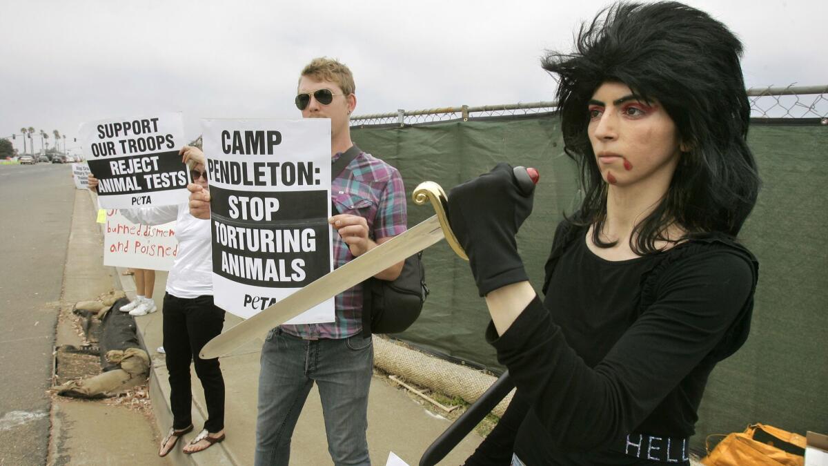 Nasim Najafi Aghdam, right, at a People for the Ethical Treatment of Animals protest in 2009 in San Diego County.