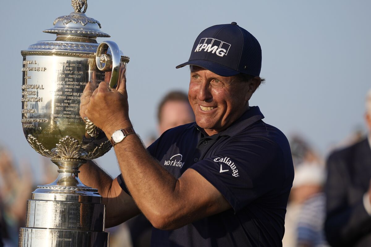 Phil Mickelson holds the Wanamaker Trophy after winning the PGA Championship on May 23, 2021, in Kiawah Island, S.C.