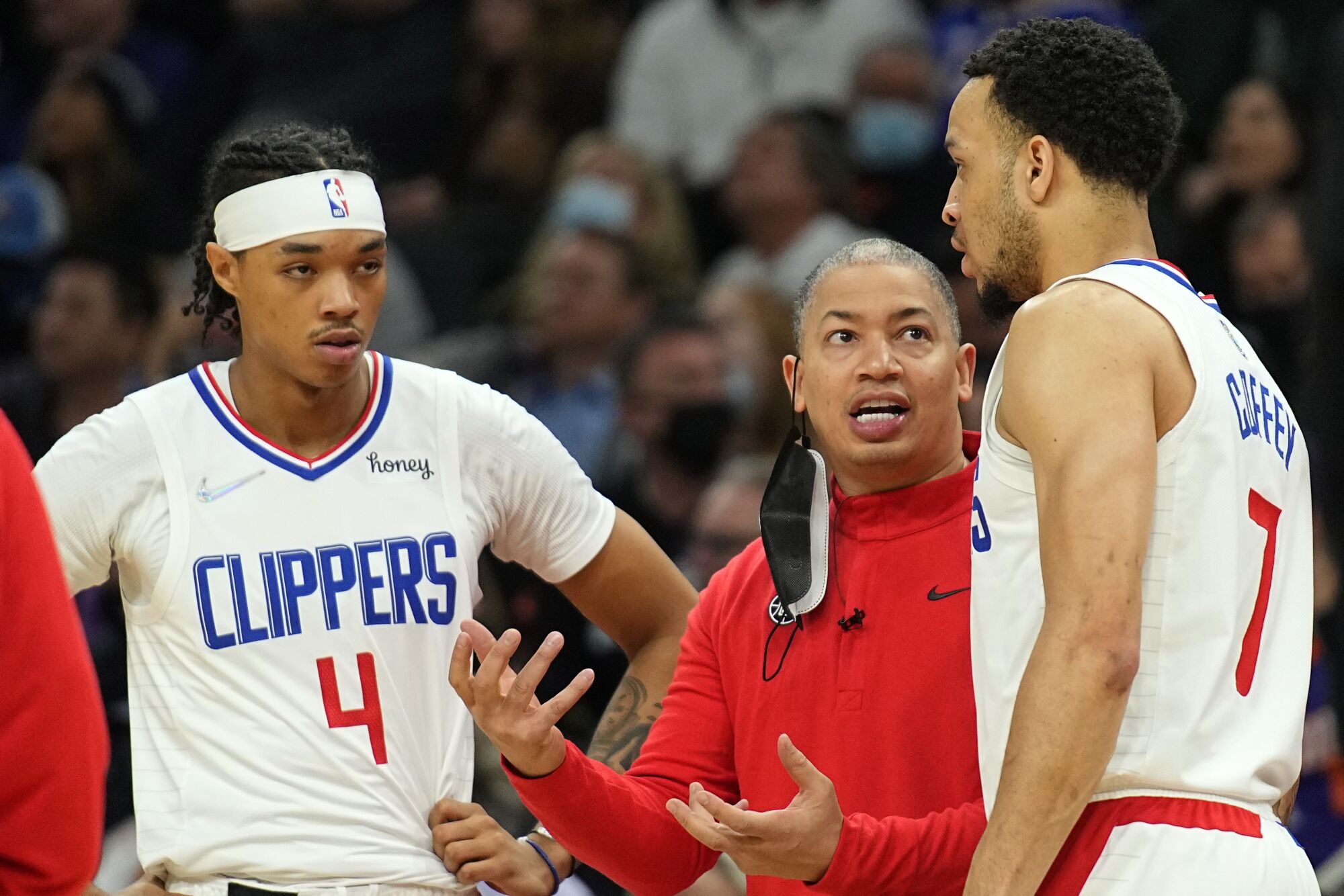 Clippers coach Tyronn Lue talks to up-and-coming players Brandon Boston Jr., left, and Amir Coffey.