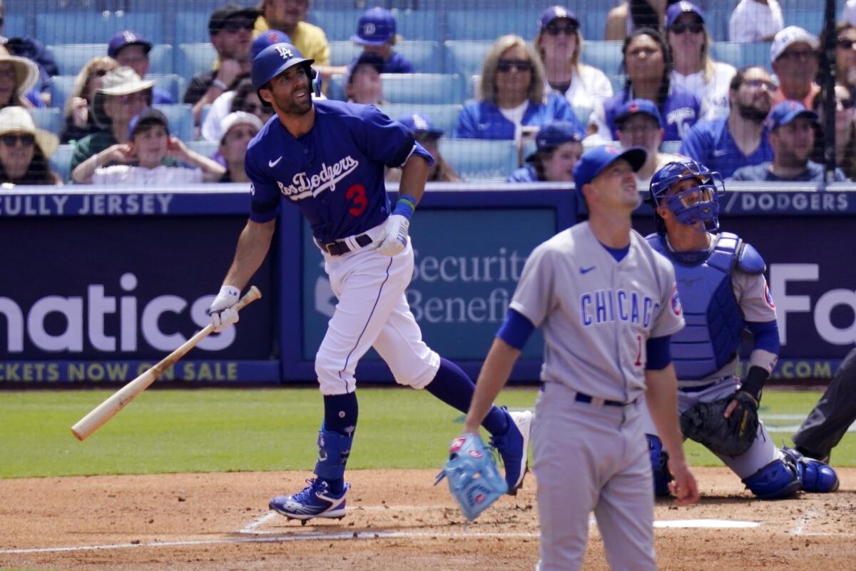 Chris Taylor holds the bat after hitting a home run.