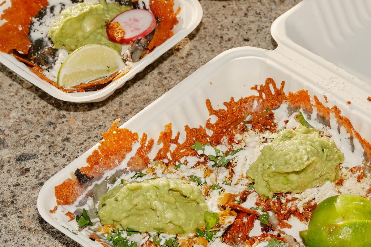 Takeout containers from Villa's Tacos.