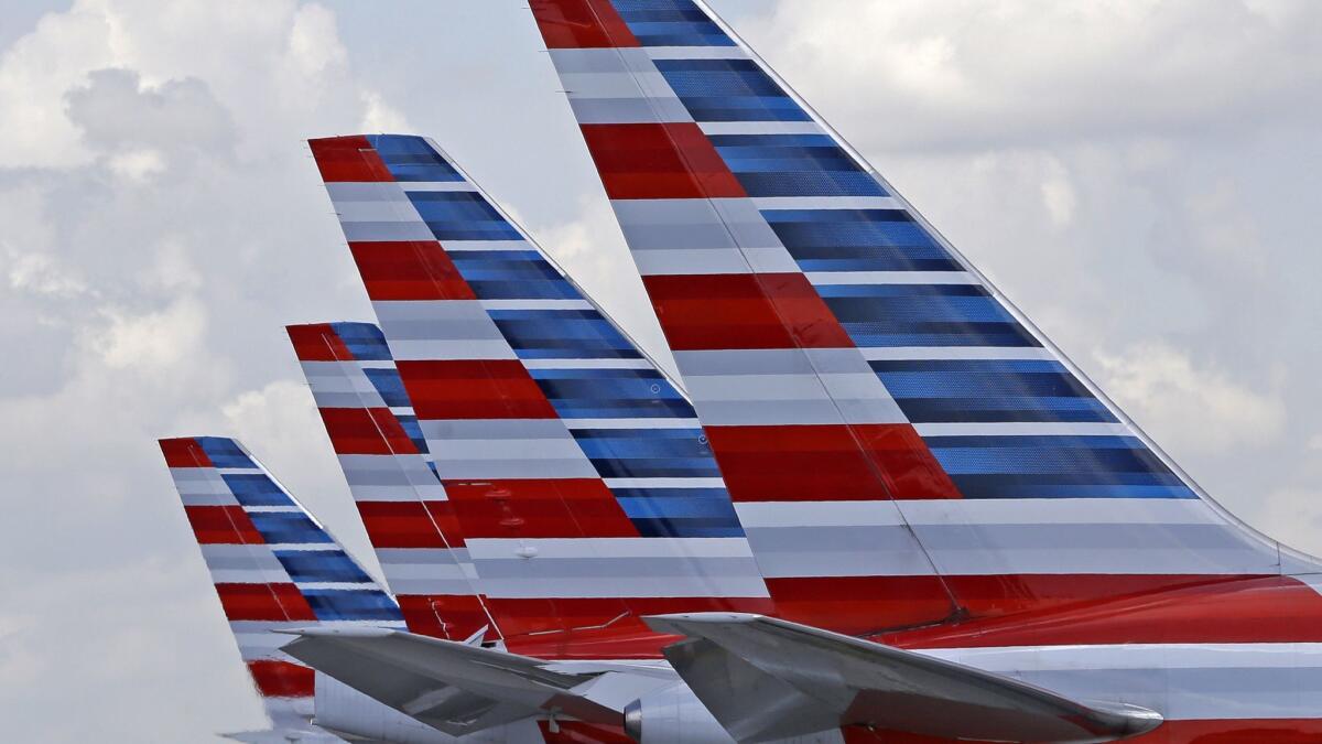 The NAACP has lifted a travel advisory it issued against American Airlines last fall after a series of incidents. Above, American planes at Miami International Airport.