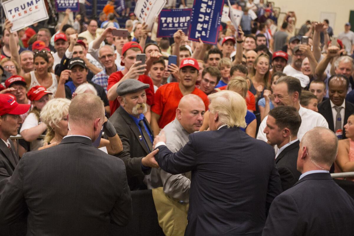 Donald Trump greets supporters after a rally in Windham, N.H., on Saturday.