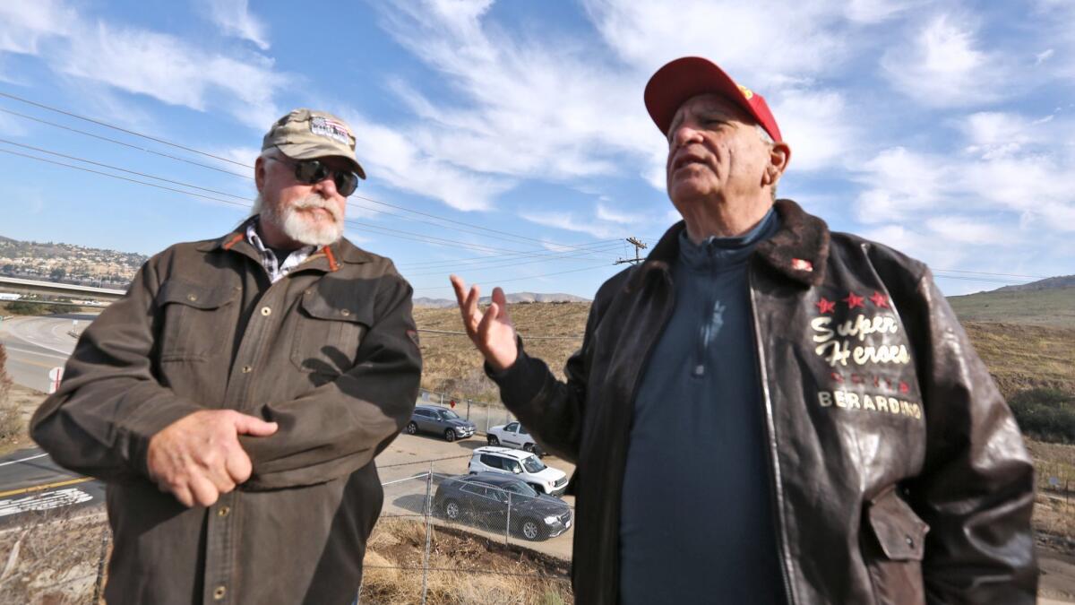 Bill Cook, left, and Nick Berardino from the Veterans Alliance of Orange County talk about land allocated for a veterans cemetery at Gypsum Canyon Road and Santa Ana Canyon Road in Anaheim.