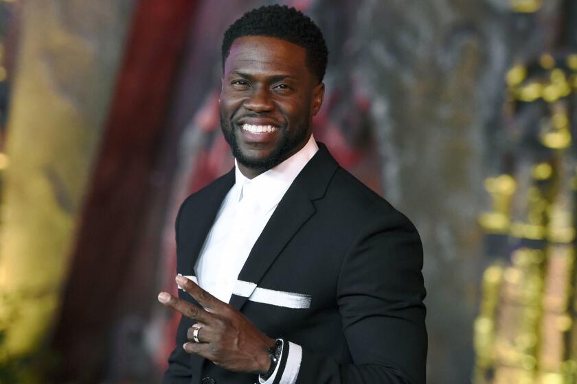 FILE - In this Dec. 11, 2017 file photo, Kevin Hart arrives at the Los Angeles premiere of "Jumanji: Welcome to the Jungle" in Los Angeles. Hart will host the 2019 Academy Awards, fulfilling a lifelong dream for the actor-comedian. Hart announced Tuesday, Dec. 4, 2018, his selection in an Instagram statement and the Academy of Motion Picture Arts and Sciences followed up with a tweet that welcomed him "to the family." (Photo by Jordan Strauss/Invision/AP, File)