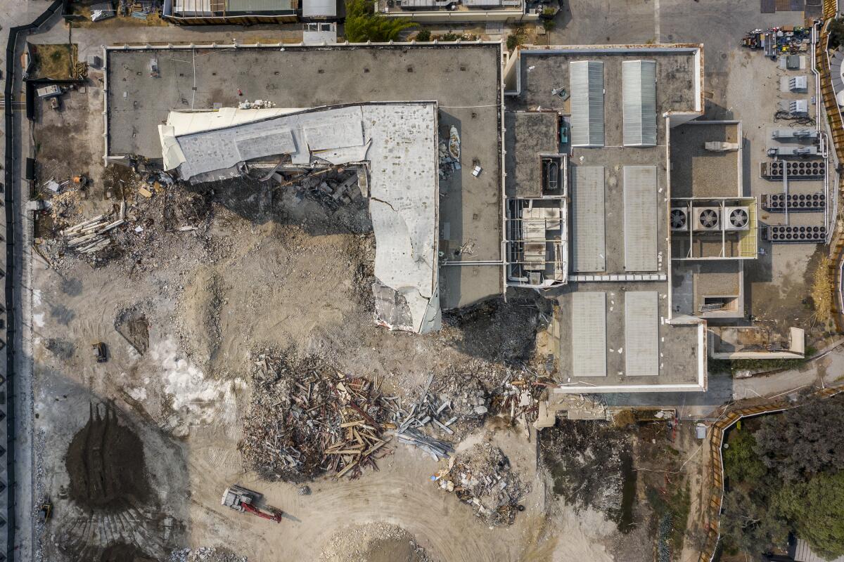 An overhead view of the demolition-in-progress at LACMA shows a buckled fragment of the Ahmanson Building.