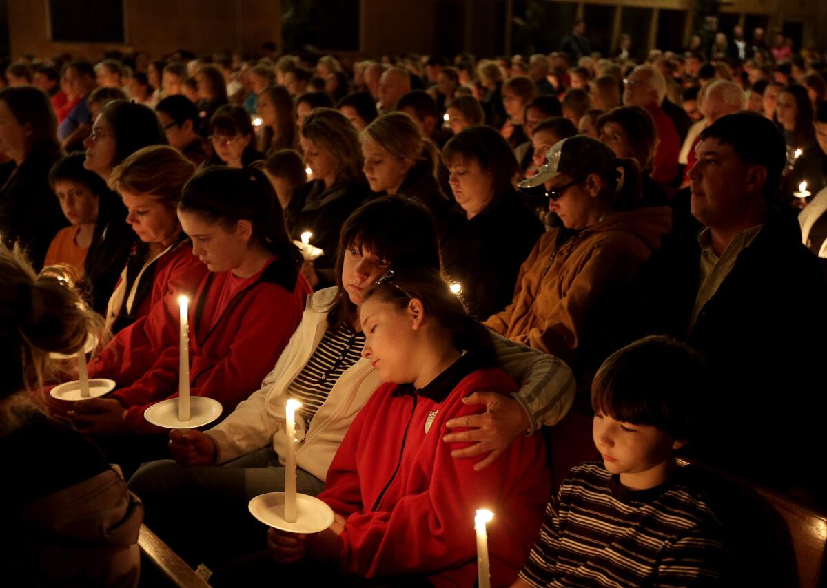 In the aftermath of the explosion at at fertilizer plant, residents of West, Texas, have turned to faith. Mourners attend a service Thursday night at Assumption Catholic Church.