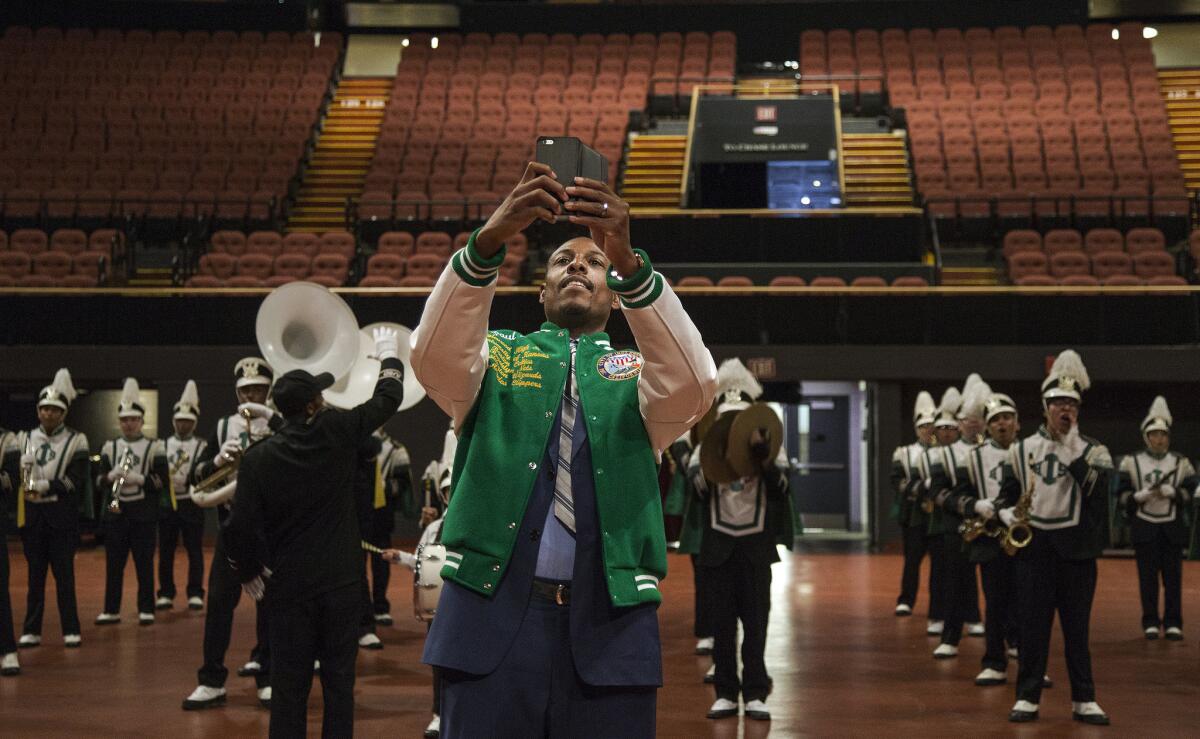 Clipper forward and Inglewood native Paul Pierce takes a selfie in front of the Inglewood High School band, who are performing for him during an event welcoming Pierce back on July 30, 2015 at The Forum in Inglewood, Calif.
