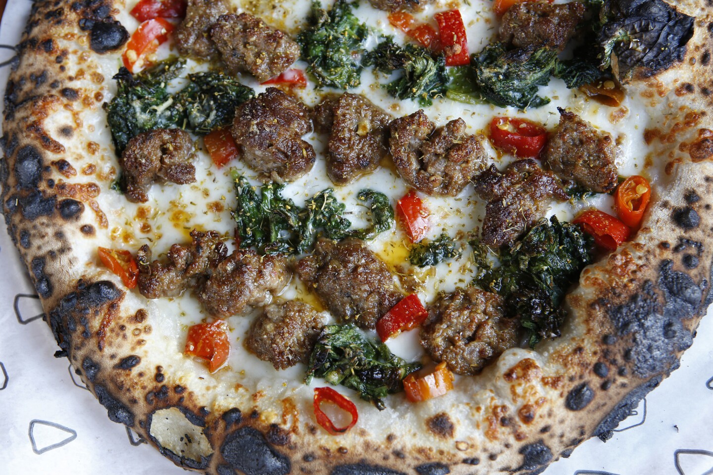 Sausage pizza with mustard greens at Cosa Buona in Echo Park.