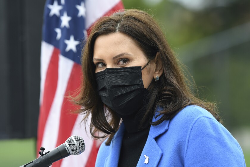 Michigan Governor Gretchen Whitmer U.S. talks about the statewide COVID-19 vaccination effort during a press conference outside the Eastern Michigan University Convocation Center, which was hosting a vaccination clinic, Monday, April 12, 2021, in Ypsilanti, Mich. (Lon Horwedel/Detroit News via AP)