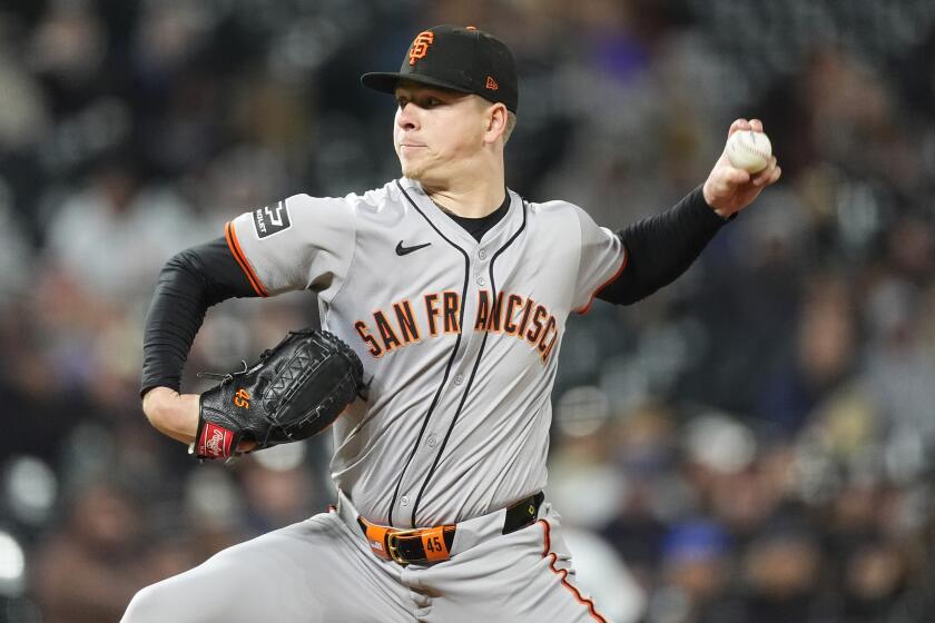 San Francisco Giants starting pitcher Kyle Harrison works against the Colorado Rockies in the seventh inning of a baseball game Tuesday, May 7, 2024, in Denver. (AP Photo/David Zalubowski)