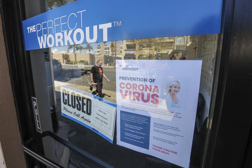 A La Jolla business along Pearl Street called The Perfect Workout displays a coronavirus COVID-19 related closed sign outside their business on March 17, 2020 in San Diego, California.