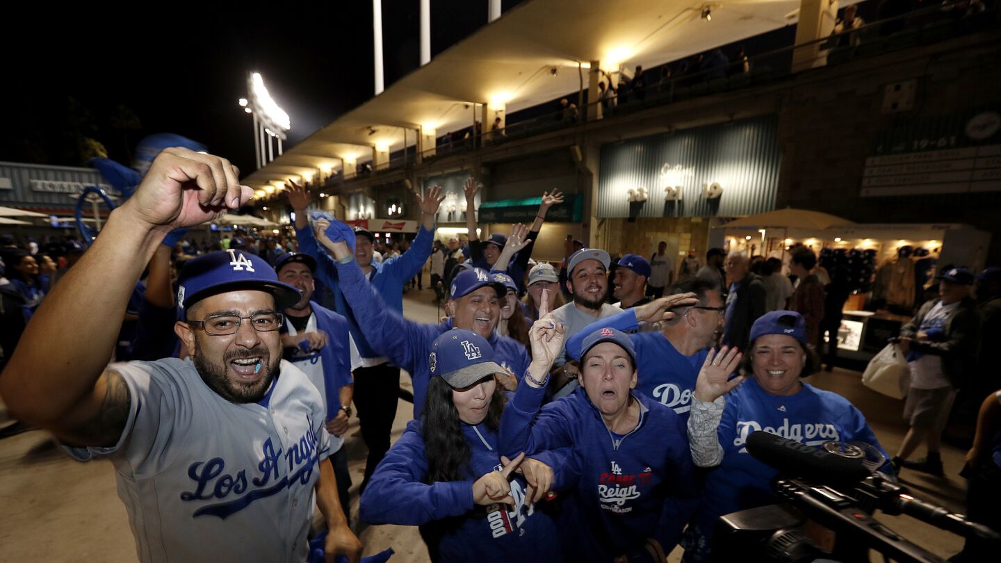 Fans celebrate as they exit Dodger Stadium after the Dodgers beat the Astros 3-1 in Game 6.