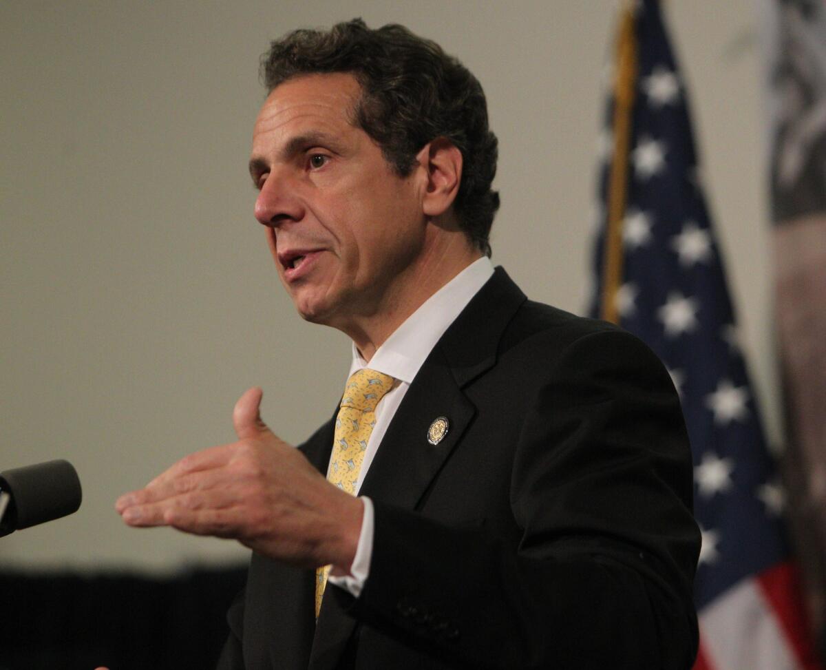 Gov. Andrew Cuomo speaks at the University at Buffalo Law School on July 3. On Wednesday, Cuomo announced that rates for individual insurance policies in the state would be sharply lower in 2014.