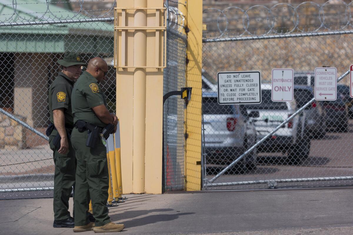 Border Patrol agents stand near the site where a Mexican detainee was fatally shot at the Ysleta Border Patrol Station, Tuesday, Oct. 4, 2022, in El Paso, Texas. According to officials, the man later died at an El Paso hospital. The Mexican Consulate in El Paso said in a statement that the man was a Mexican citizen who was being processed on criminal charges. (Gaby Velasquez/The El Paso Times via AP)