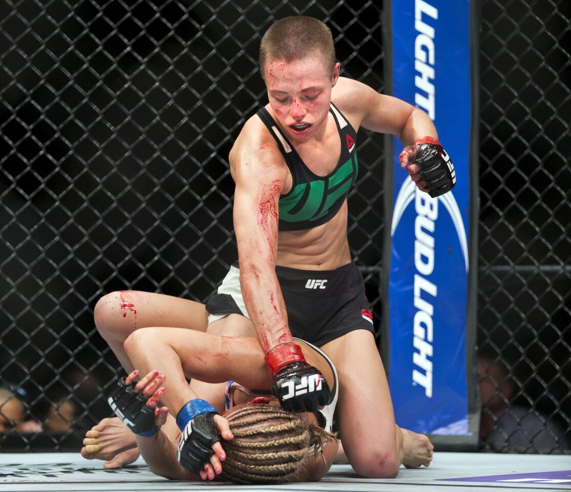 Women’s Strawweight fighter Rose Namajunas pounds the head of Paige VanZant, bottom, during a UFC Fight Night in Las Vegas.