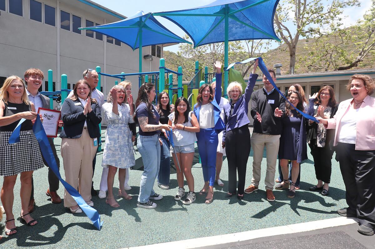 Assemblywomen Cottie Petrie-Norris and Diane Dixon, center, join staff and officials from the Boys & Girls Club of Laguna.