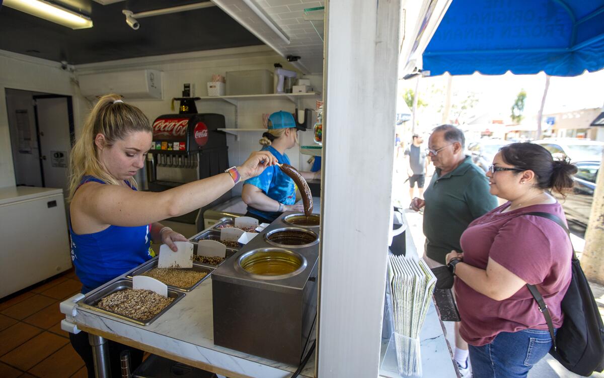 Eilish Zachary, left, and her sister, Fiona, prepare sweet treats.