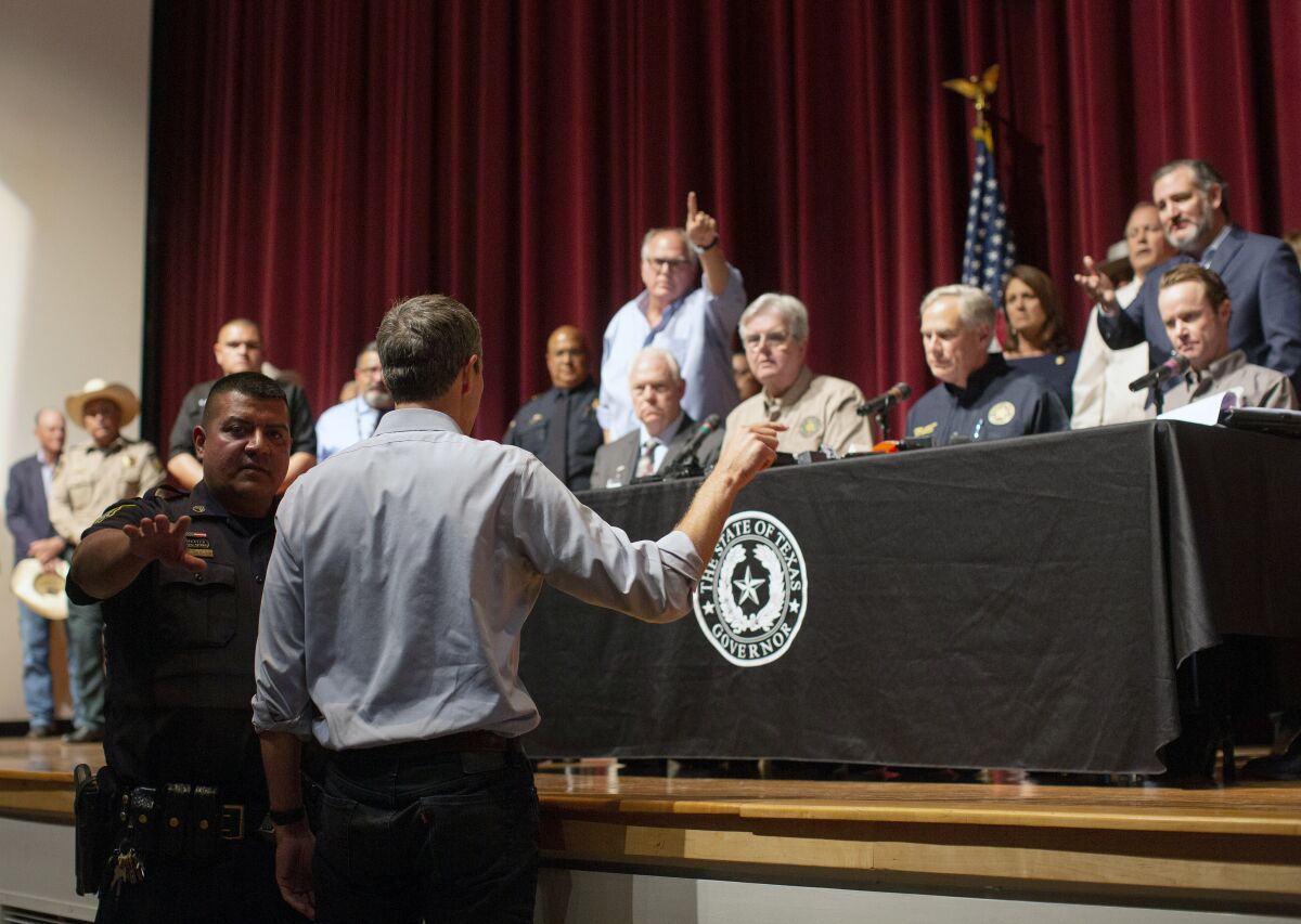 Beto O'Rourke interrupts Gov. Greg Abbott's news conference in Uvalde, Texas.