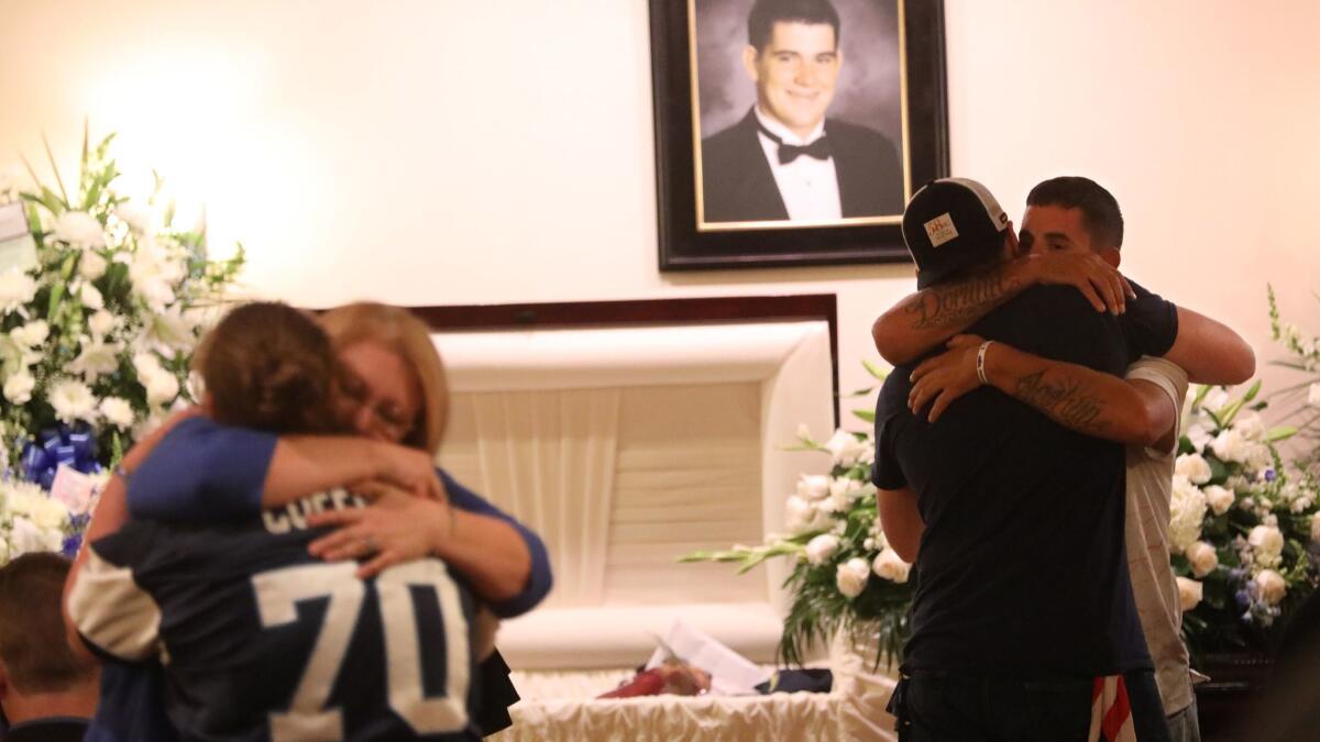 Mourners attend the memorial service for Cody Coffman, who was one of 12 killed by a gunman at the Borderline Bar and Grill. He had just turned 22 years old.