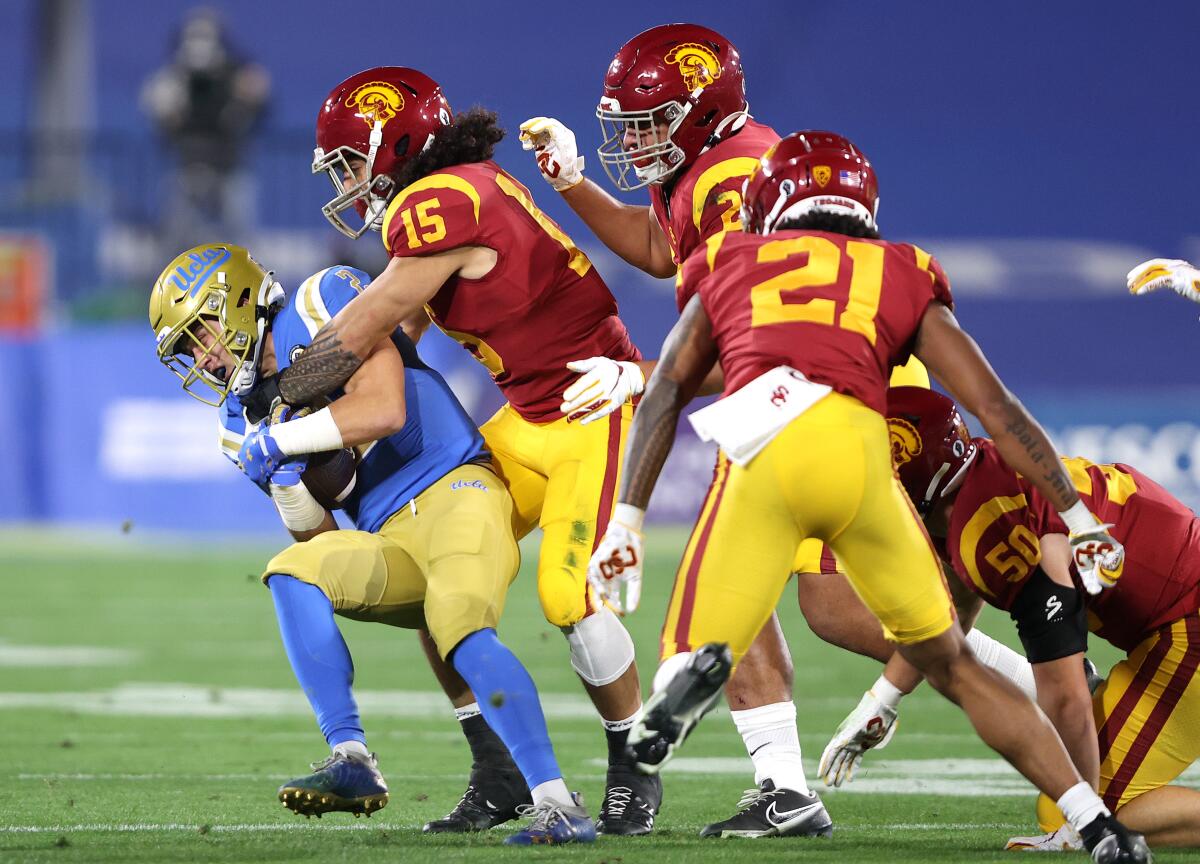 USC safety Talanoa Hufanga tackles UCLA wide receiver Kyle Philips during the first half Dec. 12, 2020.