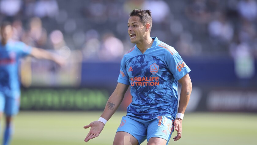Galaxy forward Javier "Chicharito" Hernández argues a call with a referee during a game.
