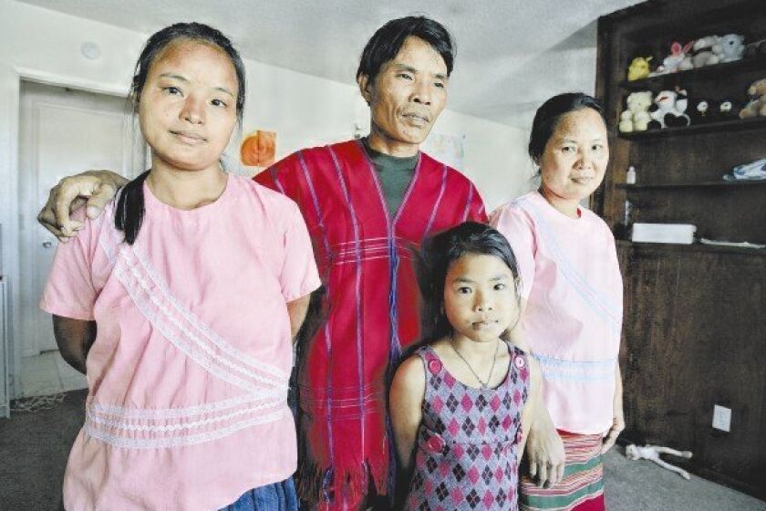 The family of Saw Reh (center) and his wife, Ku Meh (right), escaped from the oppressive regime in their homeland of Myanmar.