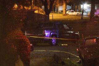 Police respond to a fatal shooting in the area of Normandale Park in Northeast Portland on Saturday evening, Feb. 19, 2022. (Mark Graves/The Oregonian via AP)