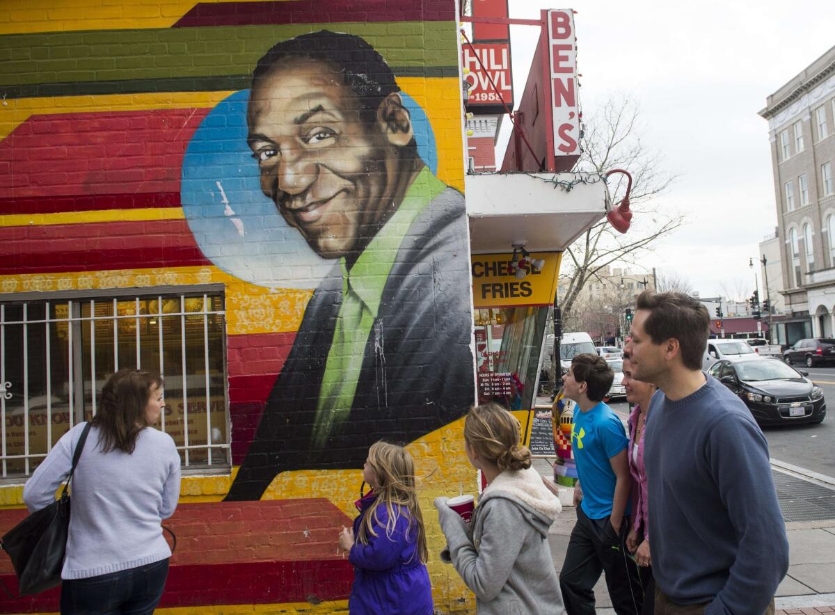 This Ben's Chili Bowl mural featuring comedian Bill Cosby, photographed in 2016, has been removed from the wall of the Washington, D.C., eatery and replaced with images of Barack and Michelle Obama.