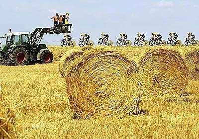 The ONCE team and its leader, Joseba Beloki, travel through the farm fields of France on their way to finishing second in the team time trial. Beloki is expected to challenge American Lance Armstrong for the overall title.