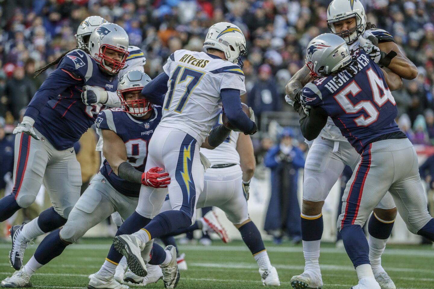 Chargers quarterback Philip Rivers is sacked by New England Patriots defensive lineman Trey Flowers late in the second quarter in the NFL AFC Divisional Playoff at Gillette Stadium.