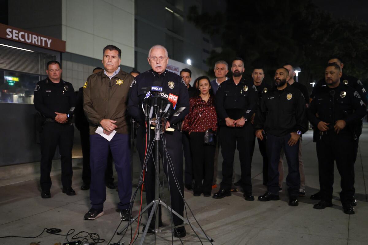 Baldwin Park Police Chief Robert A. López speaks at a microphone.