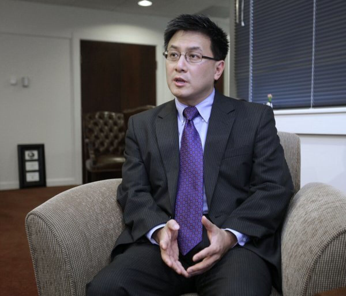 State Controller John Chiang talks with reporters in 2011.